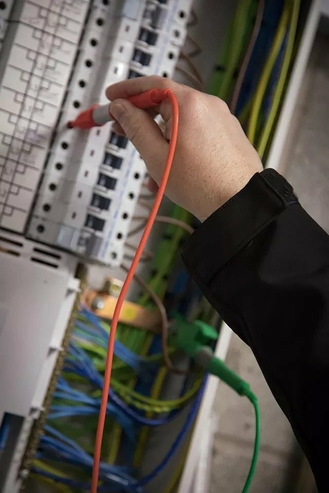 Electrical engineer conducting safety test